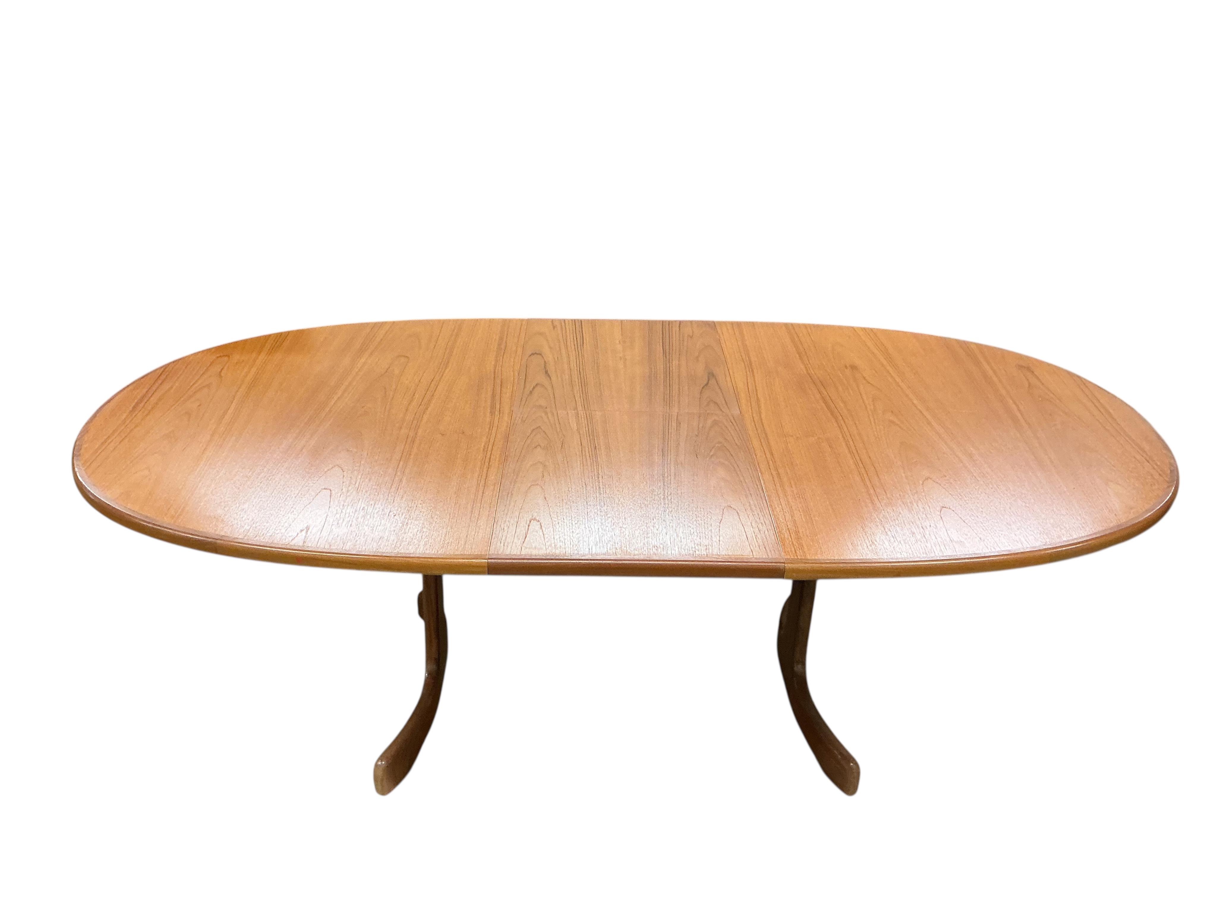 A mid century G plan teak extending dining table, width 162cm, depth 106cm, height 72cm together with a set of six chairs